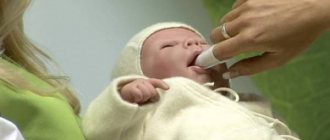 A newborn&#39;s mouth is cleaned